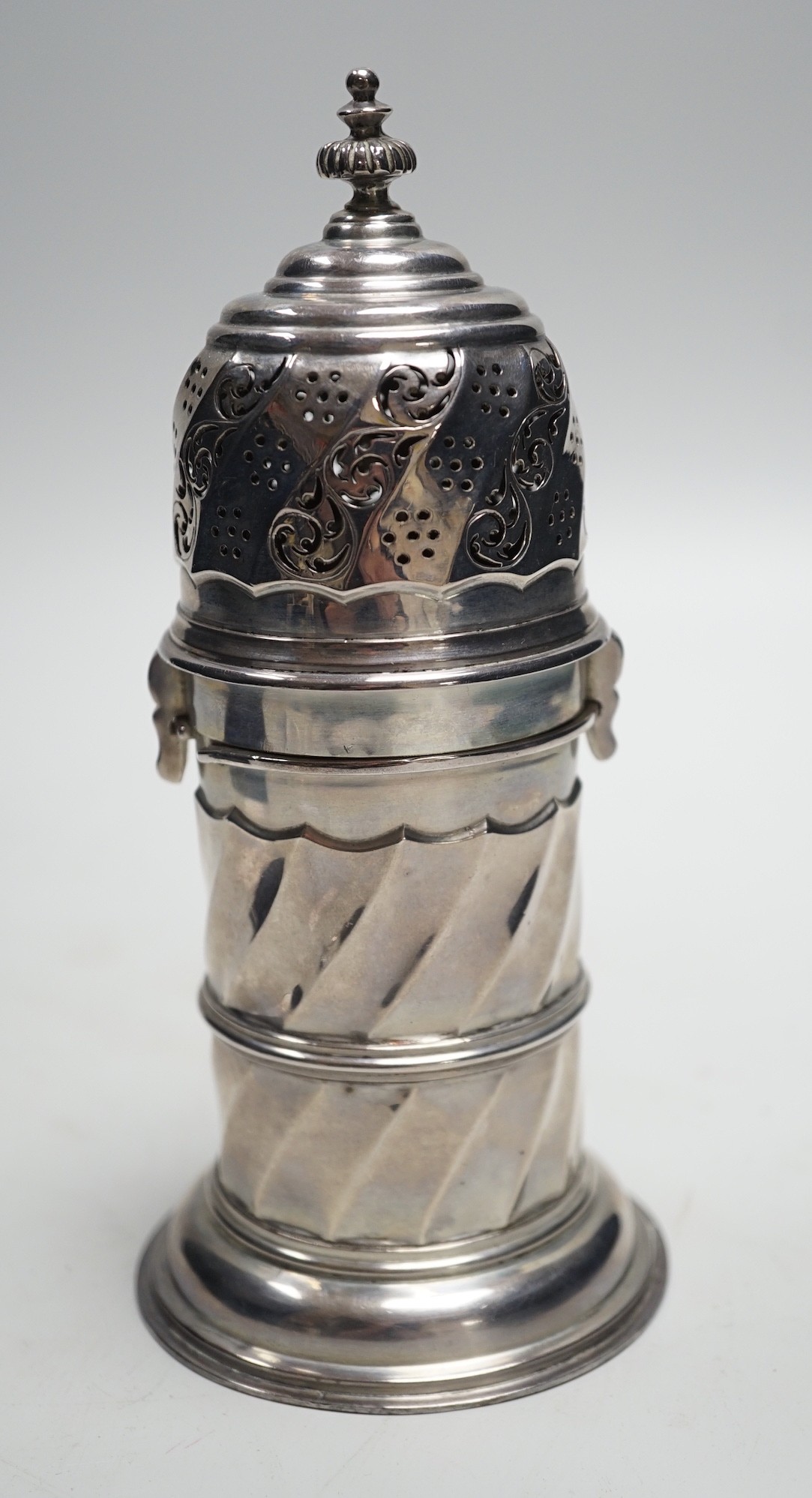 An Edwardian silver lighthouse sugar caster, with spiral body, by Nathan & Hayes, Chester, 1908, 18cm, 8.3oz.